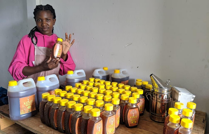 Beekeeper with Kalkap honey products